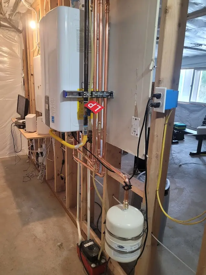 Licensed plumber repairing a kitchen sink in Little Flock